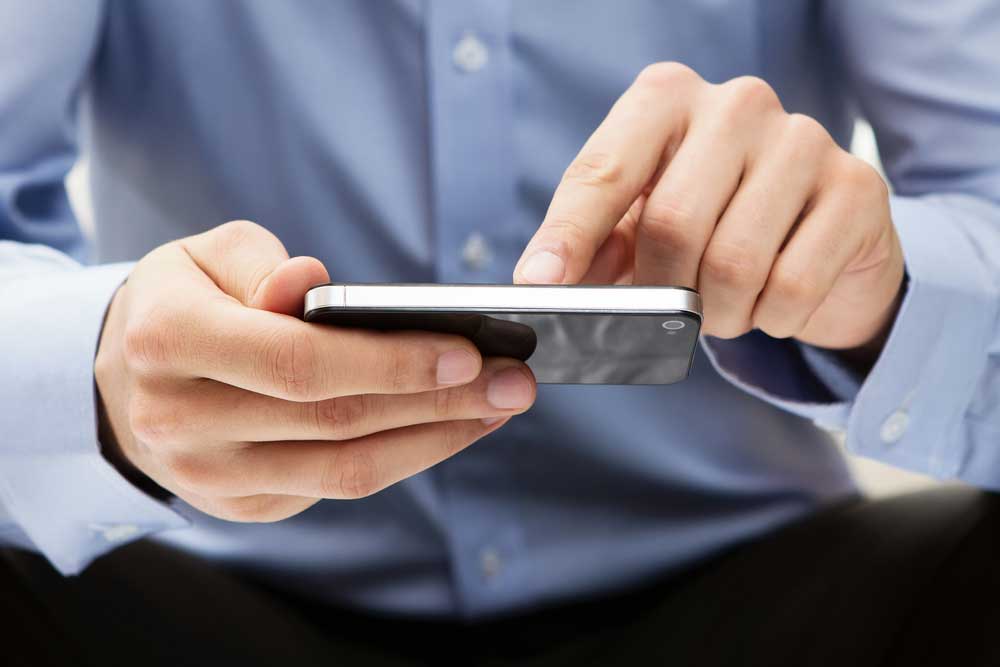 A young adult using a smartphone