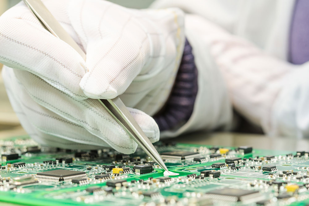 An Engineer testing a PCB